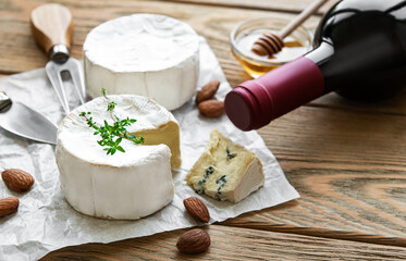 Various types of cheese,  blue cheese,  bree, camambert and wine