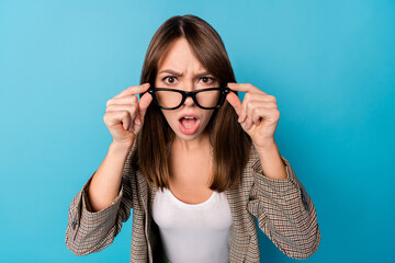 Photo of impressed nice brunette lady wear spectacles brown jacket isolated on vivid blue background