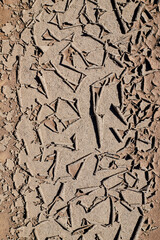 Dry cracked ground filling the frame as background. Texture for photo