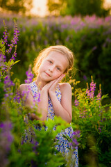 a cheerful blonde girl in a blue summer sundress, a cheerful blonde girl in a blue summer sundress, a cheerful blonde girl in a blue summer sundress,