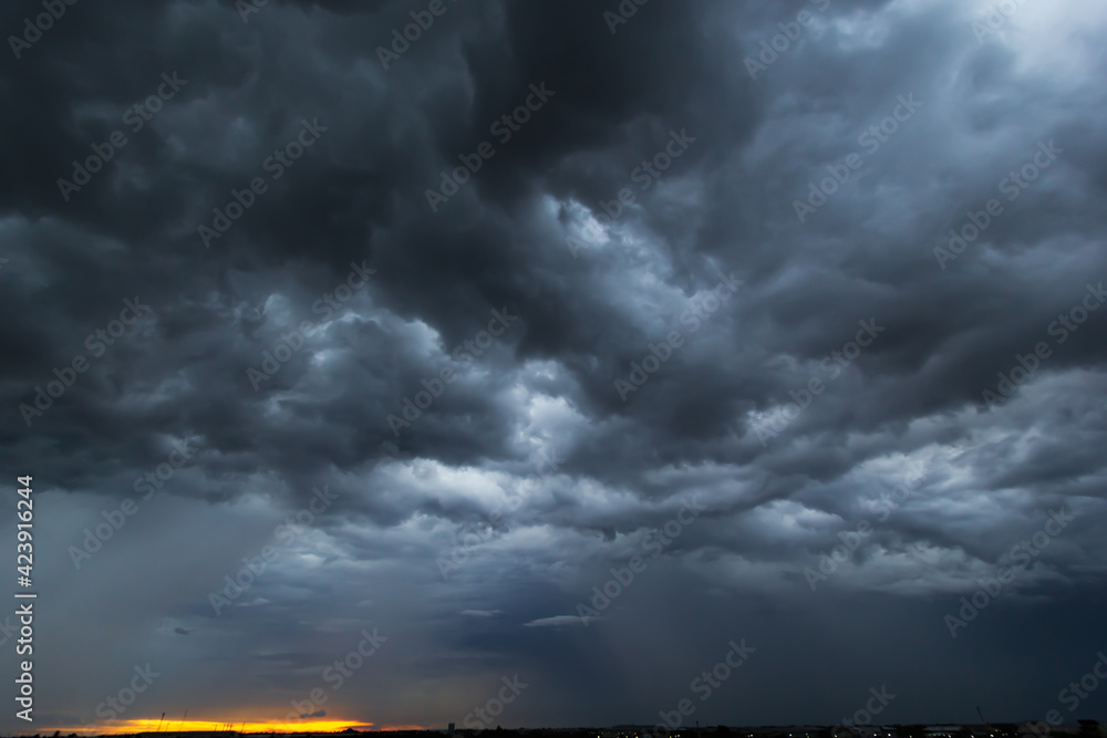 Poster The dark sky had clouds gathered to the left and a strong storm before it rained.Bad or moody weather sky.