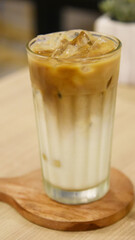 Milk and coffee with ice served on the table
