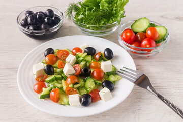 On a white plate, vegetable vitamin fresh salad for a healthy diet. 