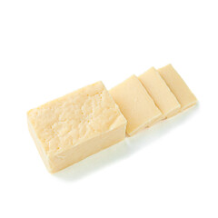 A piece of rectangular cheese without packaging. Several pieces have been cut off. View from above. White background. Isolated.