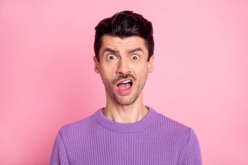 Portrait of attractive irritated funny confused guy sudden news reaction isolated over pink pastel...