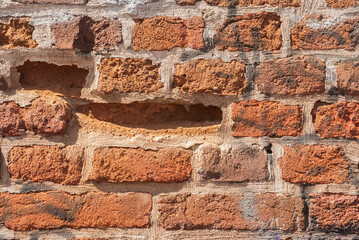 Weathered masonry brick wall closeup as brick background