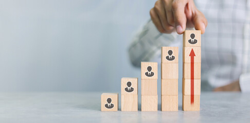 Recruiter complete team represented by wooden cube by one leader person (CEO) and icon,human...