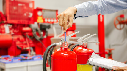 Engineer inspection Fire extinguisher and fire hose,Ready to use in the event of a fire.Safety...