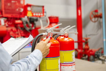 Engineer inspection Fire extinguisher and fire hose,Ready to use in the event of a fire.Safety first concept.