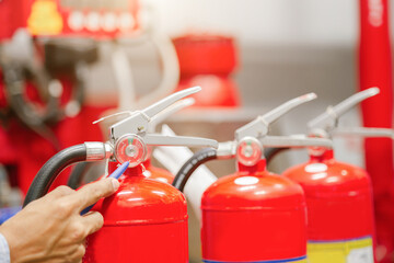 Engineer inspection Fire extinguisher and fire hose,Ready to use in the event of a fire.Safety first concept.