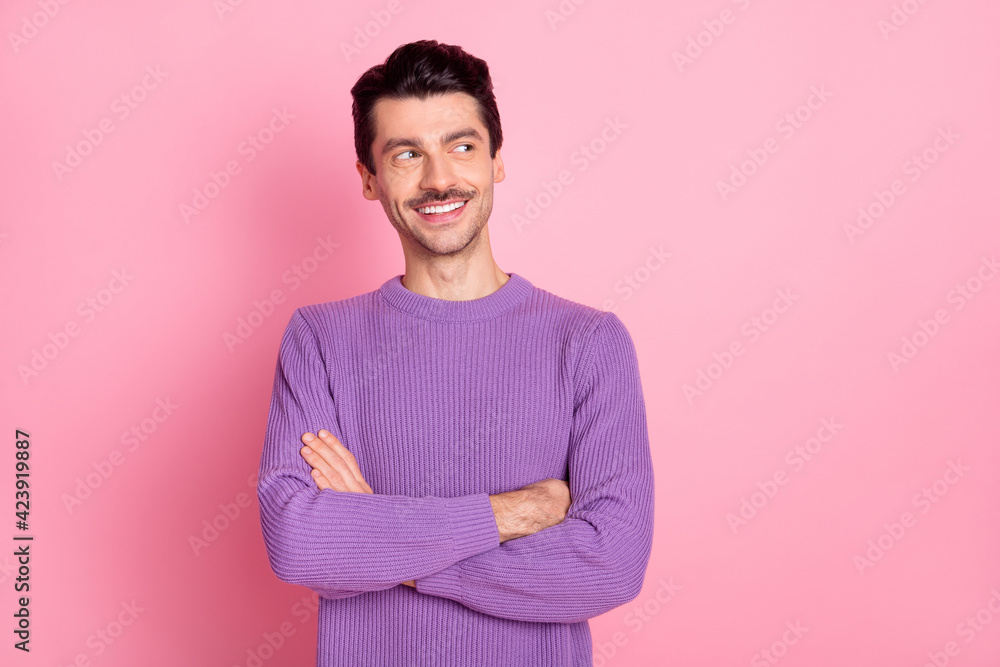 Poster Portrait of attractive cheerful guy folded arms looking aside copy space isolated over pink pastel color background