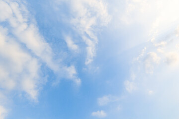 blue sky background with white clouds soft focus. creating a miraculous abstract shape.