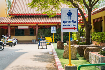 Nonthaburi, Thailand- March 08, 2021 :A sign showing the way to the toilets in Leng Noei Yi 2 or Mangkon Temple at Nonthaburi