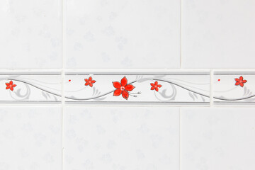 Red and white flower pattern tiles on the wall.
