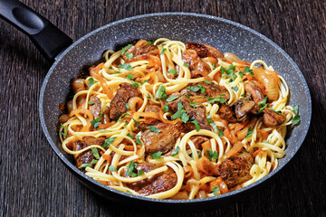 pasta linguine with fried chicken liver, top view