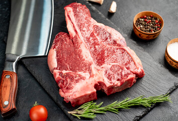 raw T-Bone Beef Steak on stone background