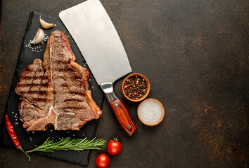 Grilled T-Bone Beef Steak on a stone background with copy space for your text