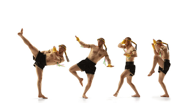Young man thai boxer on white background in motion of step to step leg kicking.