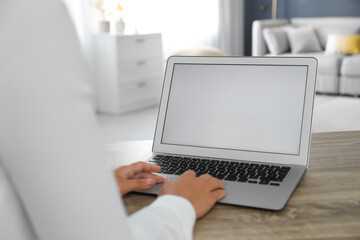 Coworkers working together online. Young woman using video chat on laptop, closeup