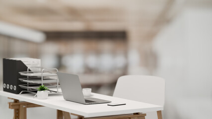 3D rendering, office interior with simple office desk with laptop and office supplies in blurred background