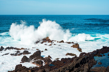 Sea waves breaking against the rocks in Tenerife. Canary Islands.