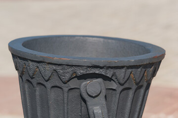 Fragment of a metal urn on the street