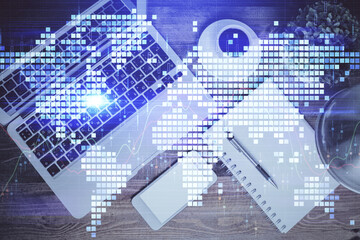 Business theme hologram drawings over computer on the desktop background. Top view. Multi exposure. Concept of international connections.