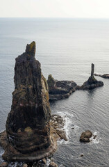 Three Maidens rock formations at the ocean on Isle of Skye in northern Scotland.
