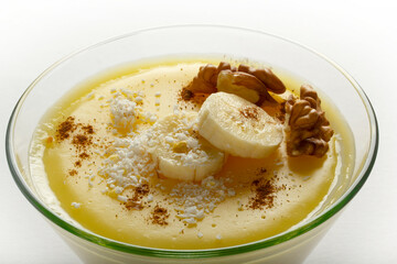 Milk and banana pudding. With coconut and cinnamon.