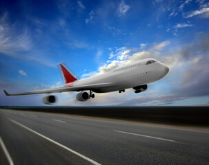 Fototapeta na wymiar Modern white airplane landing on runway