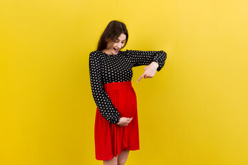 Young surprise or shocked woman pregnant isolated colored background. expression female
