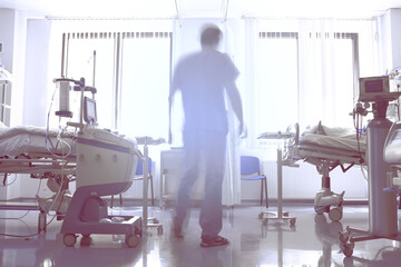 Abstract silhouette of a male doctor in a hospital room