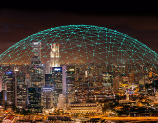 Communication connection network dome shaped above city skylilne at night. Concept of 5G coverage or Internet of Things. - 423930819