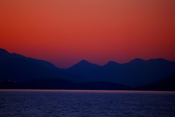 red sunset in the mountains, landscape nature silhouette of mountains at sunset, summer look