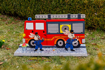 Easter Bunny with a fire engine at the Easter Bunny Trail of Herleshausen in Germany