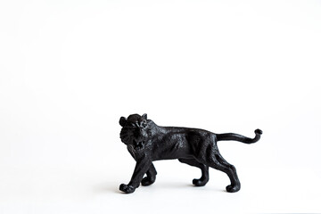 Black tiger toy isolated on white background.