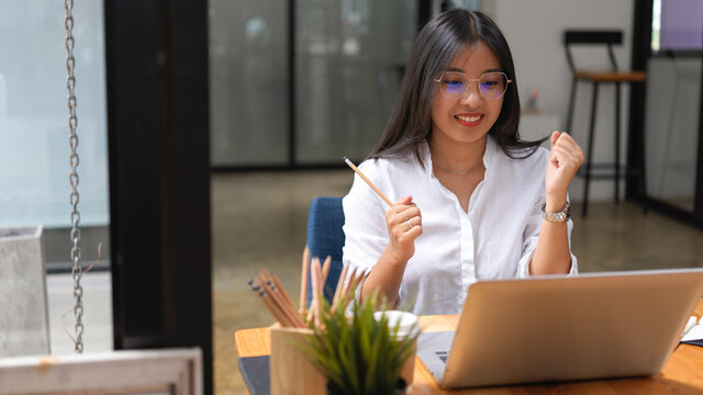 Businesswoman getting exited after hearing a good news on her project