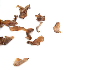 Dried tamarind slices scattered isolated on white background