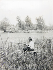 old vintage photo man with a fishing rod