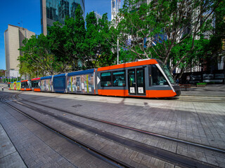 Fototapeta premium Tram moving through George St at Circular Quay in Sydney NSW Australia