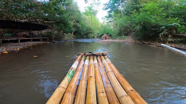Bamboo rafts on the rain forest river shot on head of baboo rafting in Maewang, Chiangmai, Thailand.