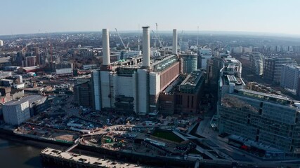 Cinematic circling aerial Drone shot of Battersea Power Station undergoing renovation