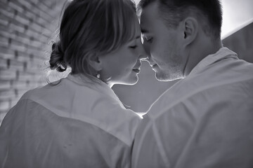 couple in love at home view from the back, man and woman relationship concept