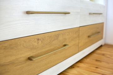 Close up of wooden drawer in contemporary cupboard cabinet.