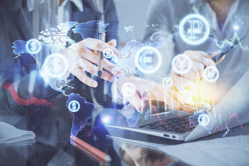 Multi exposure of man and woman working together and financial chart hologram. Business concept. Computer background.