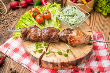Delicious juicy skewered meat or shish kebabs on skewers of pork tenderloin