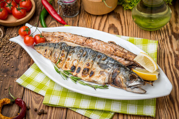 fried mackerel fish on grill close-up