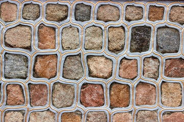 texture of stone wall with sealed and painted seams