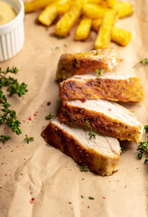 Grilled pork meat sliced on the kitchen table. Selective focus. Shallow depth of field.