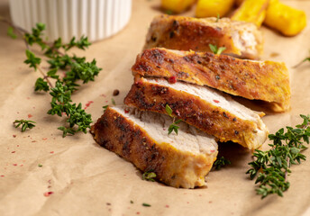 Grilled pork meat sliced on the kitchen table. Selective focus. Shallow depth of field.